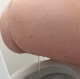 A pregnant woman bends over in front of a toilet while taking a piss and a firm, tapered shit. She wipes her ass when finished. Presented in 720P HD. Over a minute.